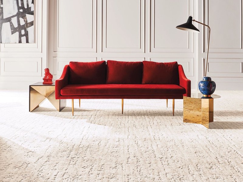 Red Couch on Nylon Carpet from King Carpet Plus in Plainview